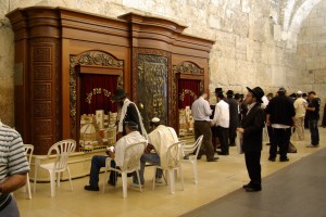 The prayer area for men includes an ark for the Torah.