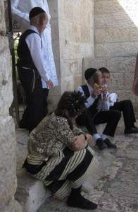 One boy was blowing on a shofar or ram's horn.