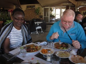 Anastasia Kiriongi and Michael Talty enjoy the chicken.